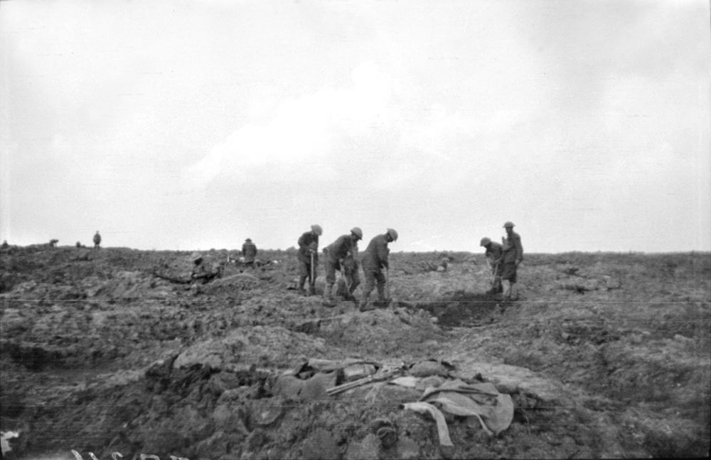 A party of English soldiers burying men who were killed in the failed attack on Passchendaele Ridge, 12 October 1917.